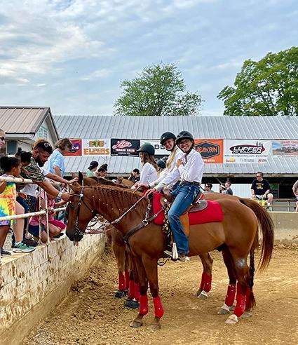 Young riders showing their horses to the crowd