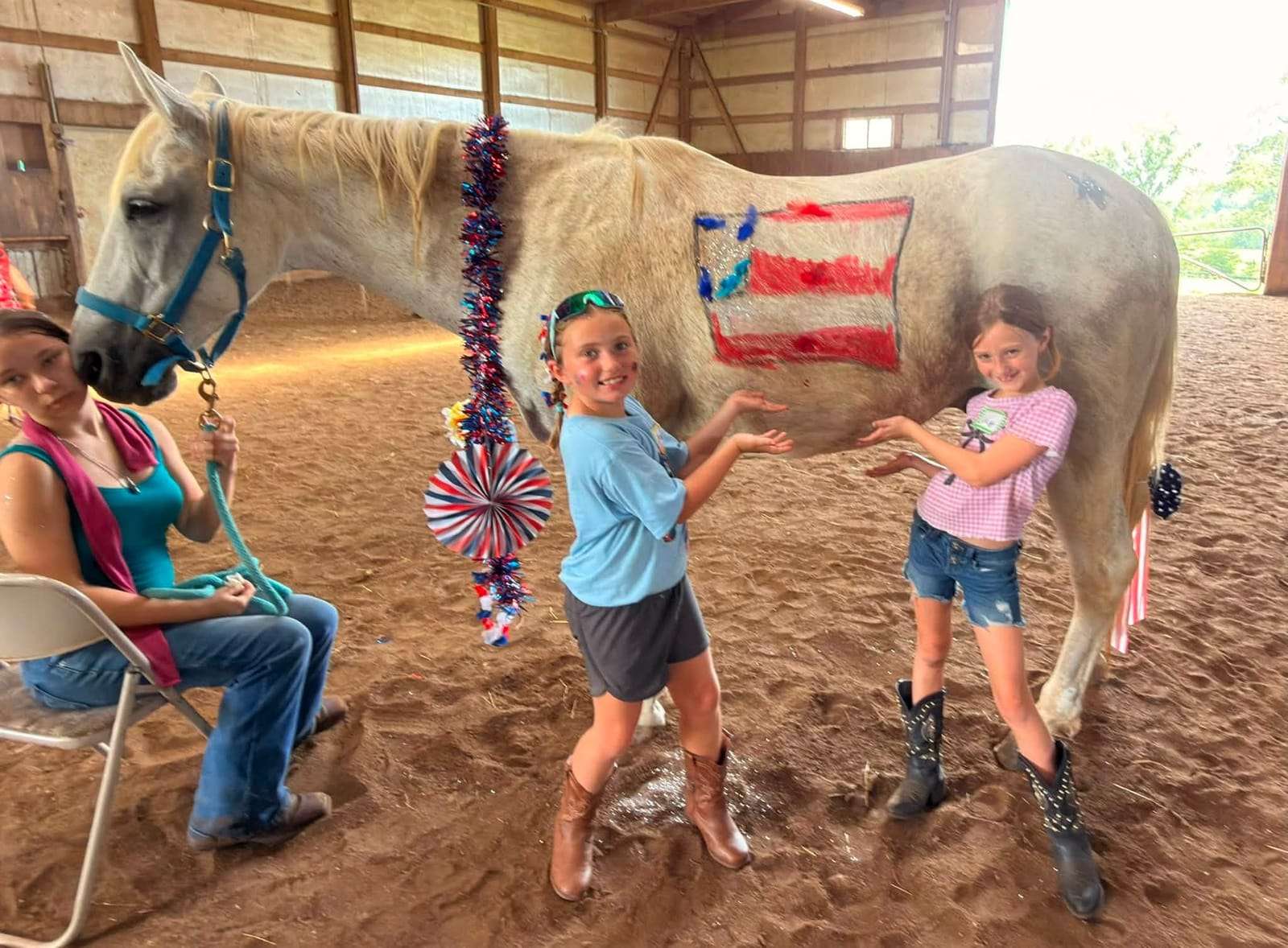 Campers with a horse painted like the American flag